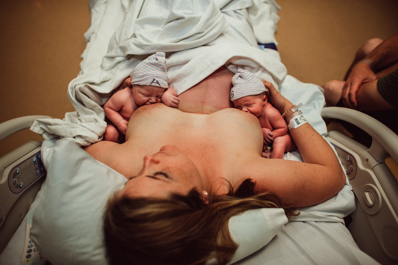 Birth Photographer, mother breastfeeding newborn twins