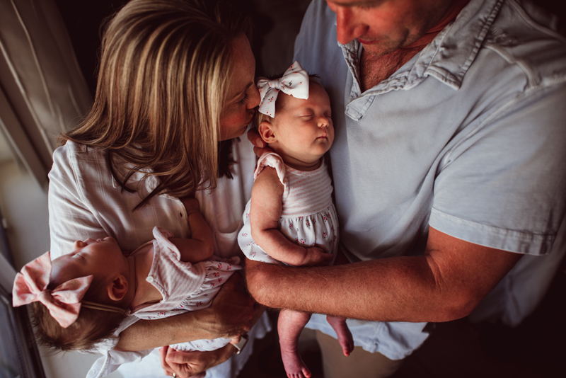 Postpartum Photography - a family of four, dad, mom and two newborn daughters,